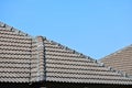 grey roof tile of house on blue sky and white cloud background Royalty Free Stock Photo