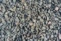 Grey rubble texture. Gravel pebbles stone background. Gray small rocks ground Royalty Free Stock Photo