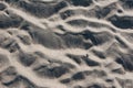 Grey sand of the beach