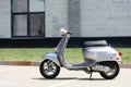 Grey scooter on road on urban