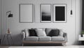 Grey settee near white cupboard in minimal living room interior with posters on the wall Royalty Free Stock Photo