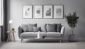 Grey settee near white cupboard in minimal living room interior with posters on the wall Royalty Free Stock Photo