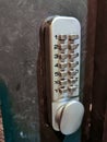 Grey silver number keypads security door locker on black door Royalty Free Stock Photo