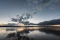 Grey sky and plateau lake in sunset Royalty Free Stock Photo