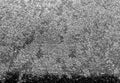 Grey snow and frost on car glass with blur effect. Royalty Free Stock Photo