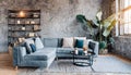 Grey sofa against concrete wall with fireplace and book shelves. Loft home interior design of modern living room Royalty Free Stock Photo