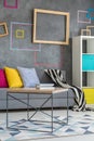 Grey sofa with colorful pillows