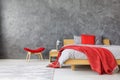 Grey bedroom with red accents Royalty Free Stock Photo