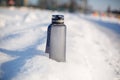 Grey spotive plastic drink bottle in snow Royalty Free Stock Photo