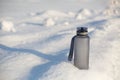 Grey spotive plastic drink bottle in snow Royalty Free Stock Photo