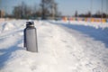 Grey spotive plastic drink bottle in snow Royalty Free Stock Photo