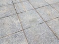 Grey square floor tiles on the ground or background