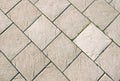 Grey square tiles. Paved footpath. Abstract background