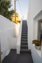 Grey stairs on a white balcony building