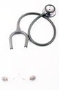 Grey stethoscope on white background