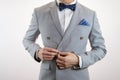 Grey suit plaid texture, bowtie, pocket square