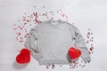 Grey sweatshirt mockup. Valentines Day concept shirt, giftbox heart shape on wooden background. Copy space, template blank front Royalty Free Stock Photo