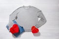 Grey sweatshirt mockup. Valentines Day concept shirt, giftbox heart shape on wooden background. Copy space, template blank front Royalty Free Stock Photo