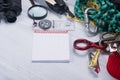 On the grey table, items for extreme sports in the mountains and wildlife, rope, magnifier, compass, binoculars, burner