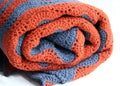 Grey and terracotta crocheted blanket Royalty Free Stock Photo