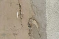 Grey texture of old broken asphalt road or wall big abrasions cracks holes on the surface pebbles cement in Sofia, Bulgaria,