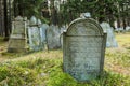 Grey tombstones with Hebrew letters on Jewish cemetery Royalty Free Stock Photo