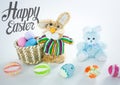Grey type and stuffed rabbit with easter eggs in basket