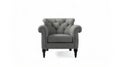 A grey upholstered chair with black legs Royalty Free Stock Photo