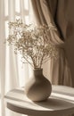 a grey vase sits on top of a white table Royalty Free Stock Photo