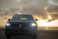 Grey Volkswagen Tiguan against a dramatic sky Royalty Free Stock Photo