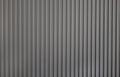 Grey wall panel. Seamless background texture of grey painted wood paneling, metal siding, ribbed background textures. Royalty Free Stock Photo