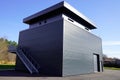 Grey warehouse exterior building storage business with steel stairs