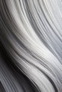 Grey wavy hair texture vertical background, silver grey wavy long shiny hair.