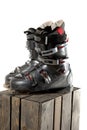 Grey well worn ski boots on a wooden crate Royalty Free Stock Photo