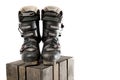 Grey well worn ski boots on a wooden crate Royalty Free Stock Photo