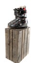 Grey well worn ski boots on a wooden crate Royalty Free Stock Photo