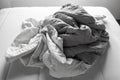 Grey and White crumpled bed sheet on white bed, Close up shot, Selective focus, Bedroom cleaning concept, Black and white tone Royalty Free Stock Photo