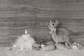 Grey, white silver christmas decoration with one burning candle Royalty Free Stock Photo