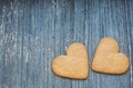 Grey wooden aged background with ginger bread biscuits. Saint valentines frame with copy space. Love and wedding Royalty Free Stock Photo