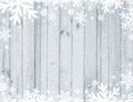 Grey Wooden christmas background with blurred white snowflakes,