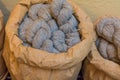 Grey wool yarn in raw paper containers