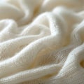 Grey woolen thread on wood creates an artful pattern on peach linen fabric Royalty Free Stock Photo