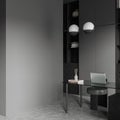 Grey workplace interior with laptop on table and decoration, mockup wall