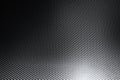 Grey woven carbon fibre sheet surface with light reflection Royalty Free Stock Photo