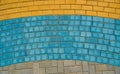 Grey, yellow and blue paving tiles for background or texture Royalty Free Stock Photo