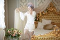 Greyhead Woman in medieval corset historic dress and lingerie posing in bed Royalty Free Stock Photo