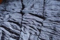 Greyish blue fabric with 3 rows of flounces