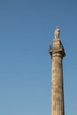 Greys Monument in Newcastle city centre showing statue of Earl Grey against a blue sky