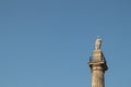 Greys Monument in Newcastle city centre showing statue of Earl Grey against a blue sky