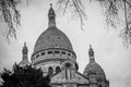Greyscale of The Basilica of the Sacred Heart of Paris under a cloudy sky in Paris in France Royalty Free Stock Photo